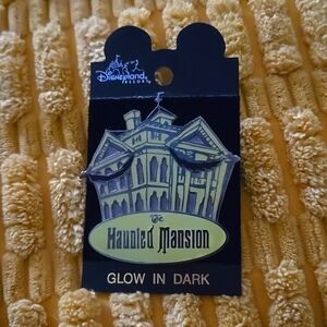 Disneyland Resort The Haunted Mansion glow in the dark collectable pin.